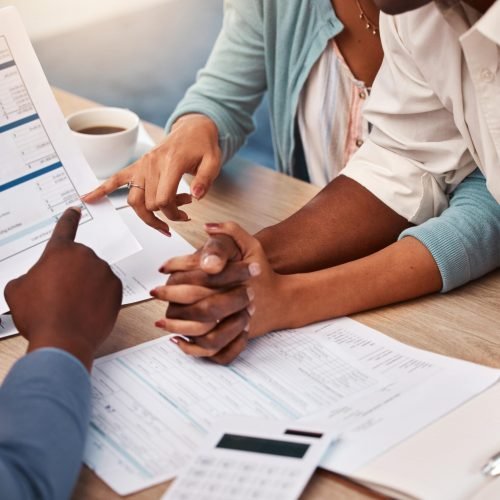 couple-holding-hands-bank-and-application-for-loa-2023-11-27-05-22-24-utc-min couple-holding-hands-bank-and-application-for-loa-2023-11-27-05-22-24-utc-min