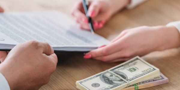 cropped-view-of-woman-signing-loan-agreement-on-cl-2023-11-27-05-15-00-utc-min cropped-view-of-woman-signing-loan-agreement-on-cl-2023-11-27-05-15-00-utc-min