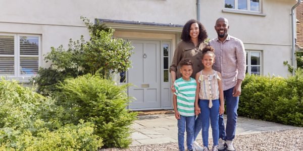 portrait-of-smiling-family-standing-outside-home-t-2023-11-27-04-57-11-utc-min portrait-of-smiling-family-standing-outside-home-t-2023-11-27-04-57-11-utc-min